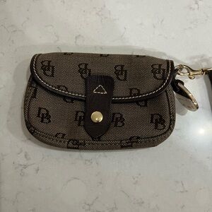 Dooney & Bourke wristlet, brown, snap closure, excellent condition.
